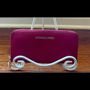 Beautiful slightly used, Merlot MK zip around wallet.